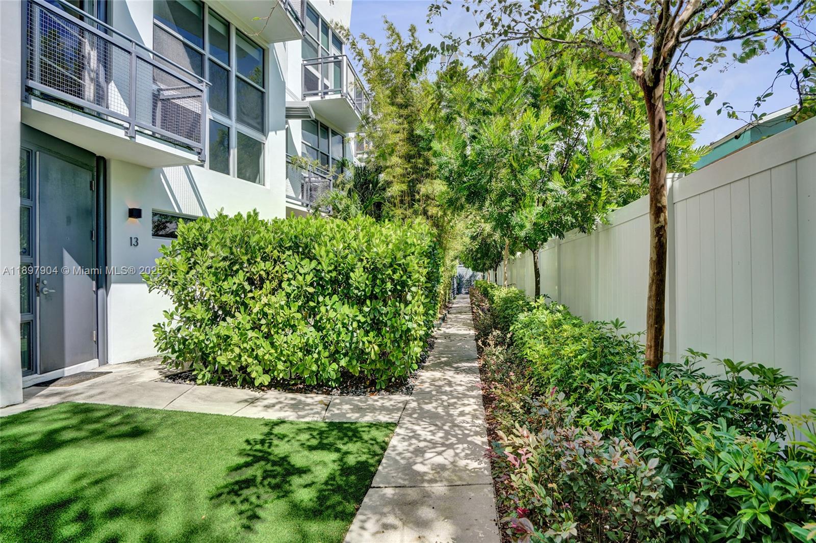 716 Southeast 12th Street, Unit 13 Fort Lauderdale, FL 33316 - Photo 37 of 45 a view of a garden with plants