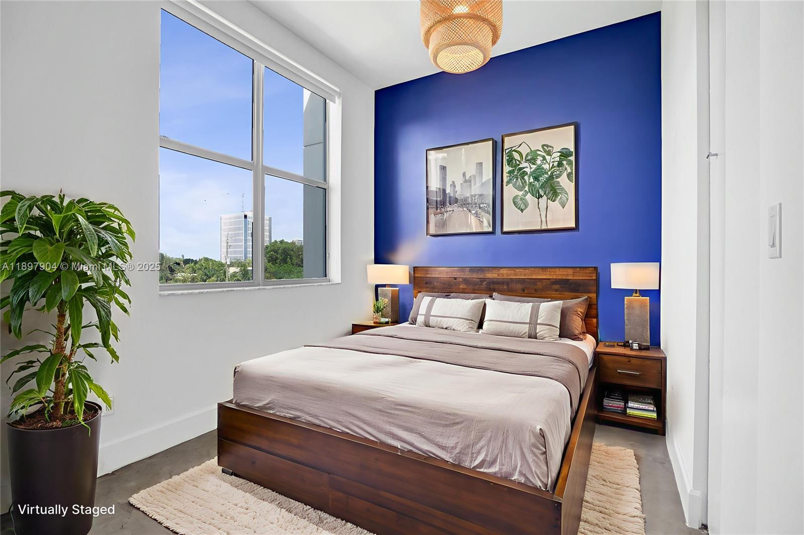 716 Southeast 12th Street, Unit 13 Fort Lauderdale, FL 33316 - Photo 6 of 45 a bedroom with a bed and a potted plant