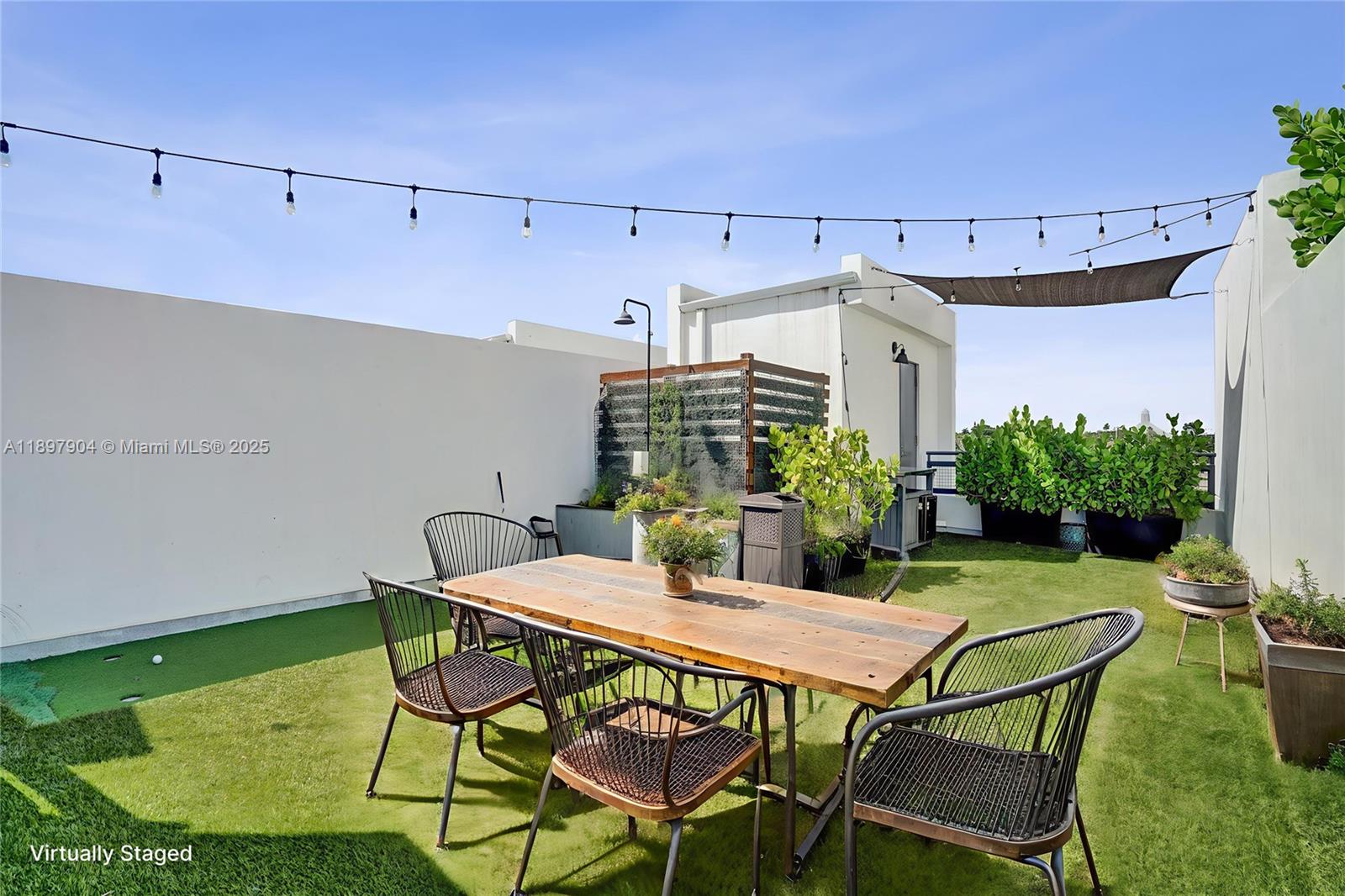 716 Southeast 12th Street, Unit 13 Fort Lauderdale, FL 33316 - Photo 7 of 45 a view of a chairs and table in the patio