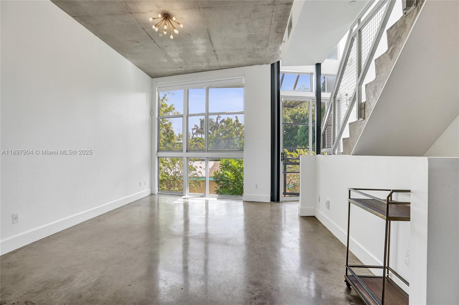 716 Southeast 12th Street, Unit 13 Fort Lauderdale, FL 33316 - Photo 8 of 45 a view of an entryway with wooden floor and windows