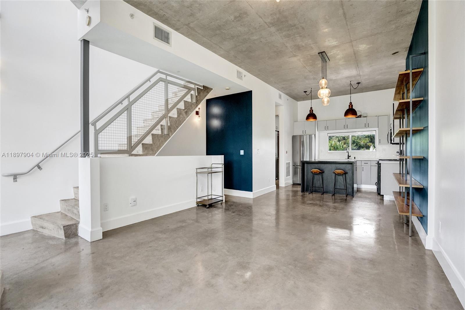 716 Southeast 12th Street, Unit 13 Fort Lauderdale, FL 33316 - Photo 10 of 45 a view of livingroom with furniture and a kitchen view