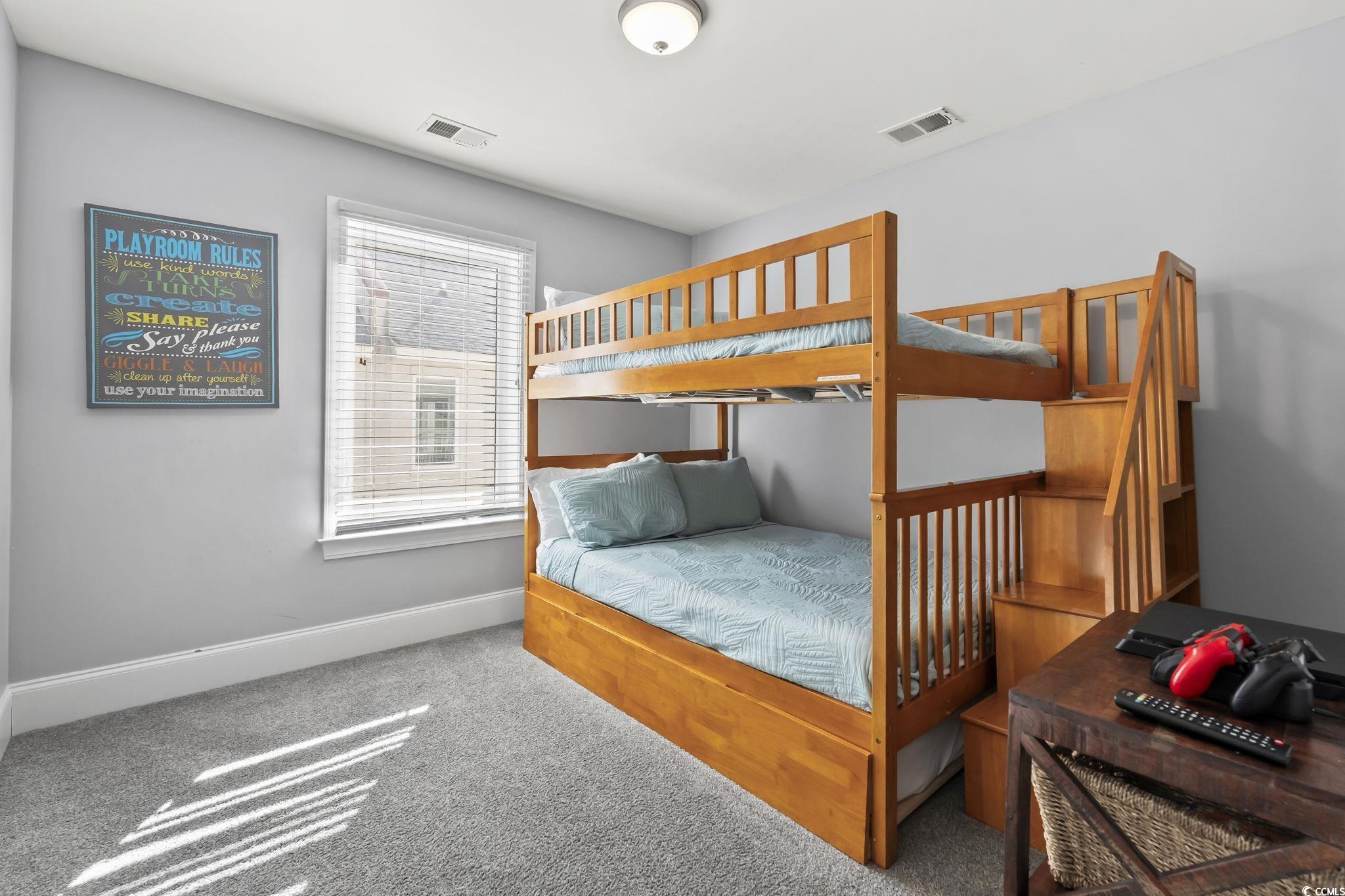 7401 North Ocean Boulevard, Unit 5 Myrtle Beach, SC 29572 - Photo 22 of 34 Carpeted bedroom with baseboards
