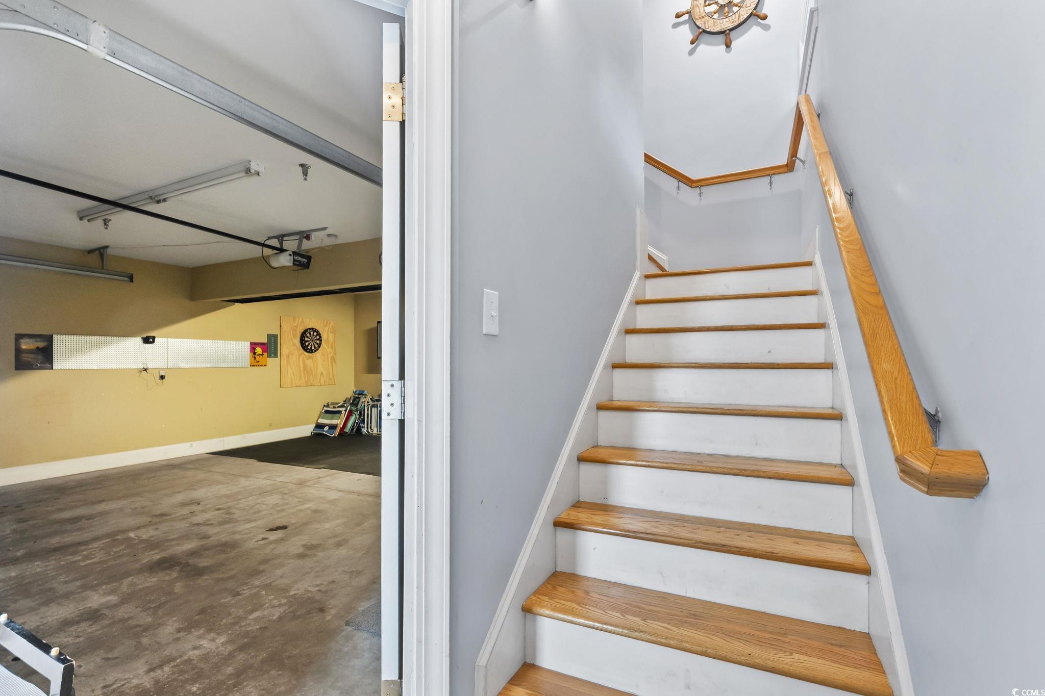 7401 North Ocean Boulevard, Unit 5 Myrtle Beach, SC 29572 - Photo 25 of 34 Staircase featuring unfinished concrete flooring