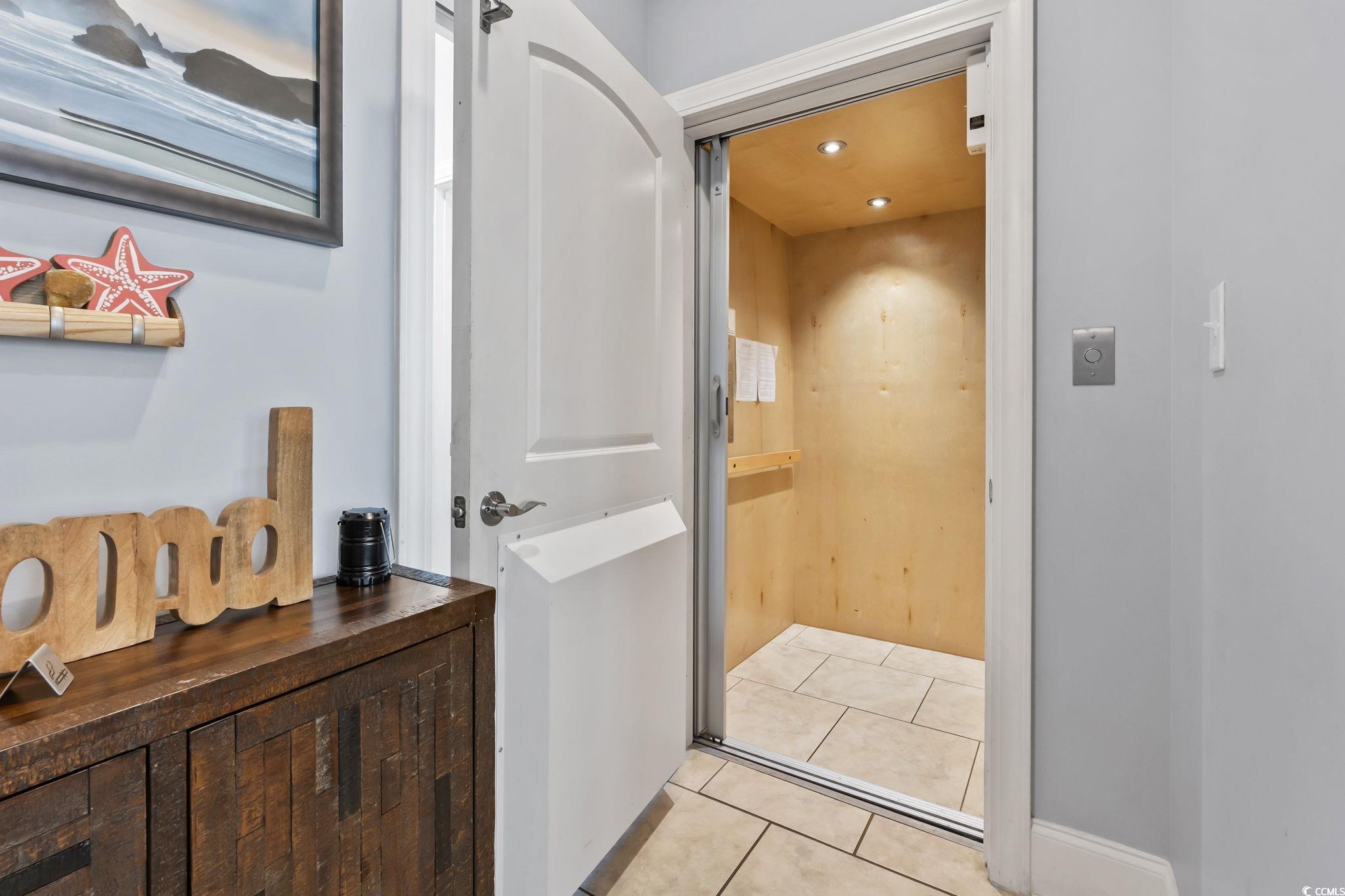 7401 North Ocean Boulevard, Unit 5 Myrtle Beach, SC 29572 - Photo 26 of 34 Elevator with recessed lighting