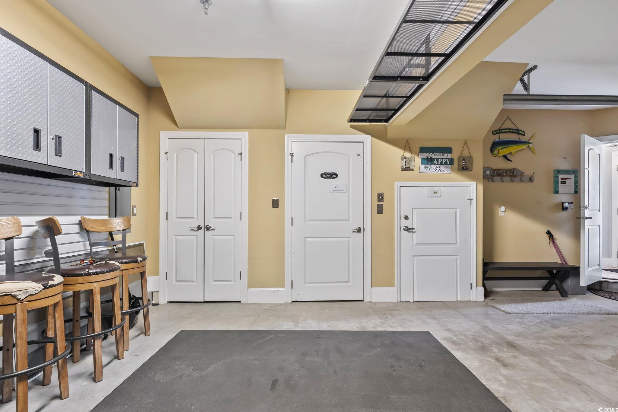 7401 North Ocean Boulevard, Unit 5 Myrtle Beach, SC 29572 - Photo 28 of 34 Garage with baseboards