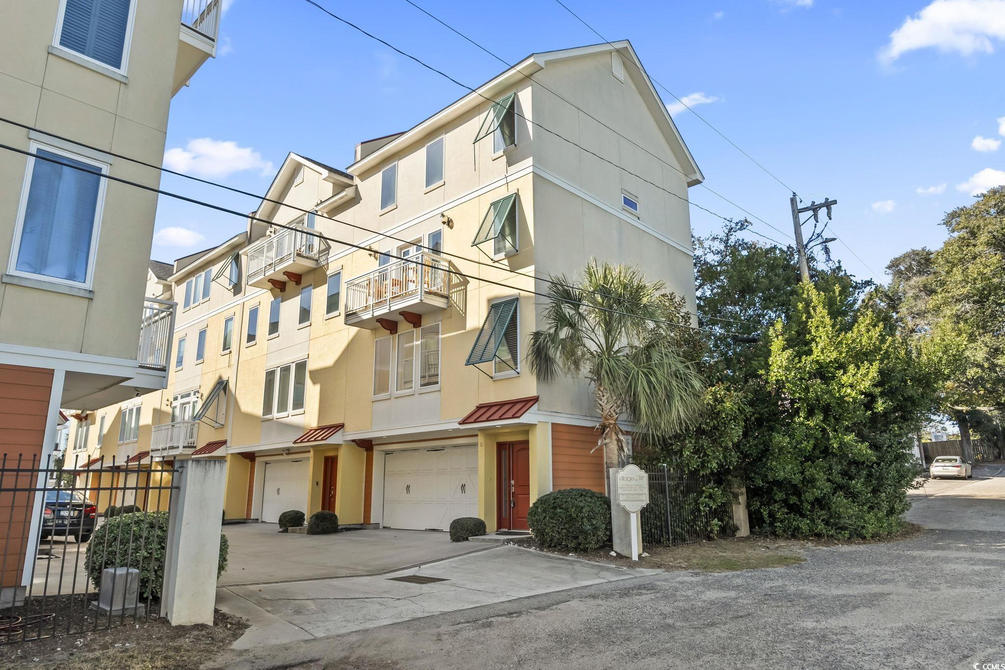 7401 North Ocean Boulevard, Unit 5 Myrtle Beach, SC 29572 - Photo 29 of 34 View of property featuring driveway and an attached garage