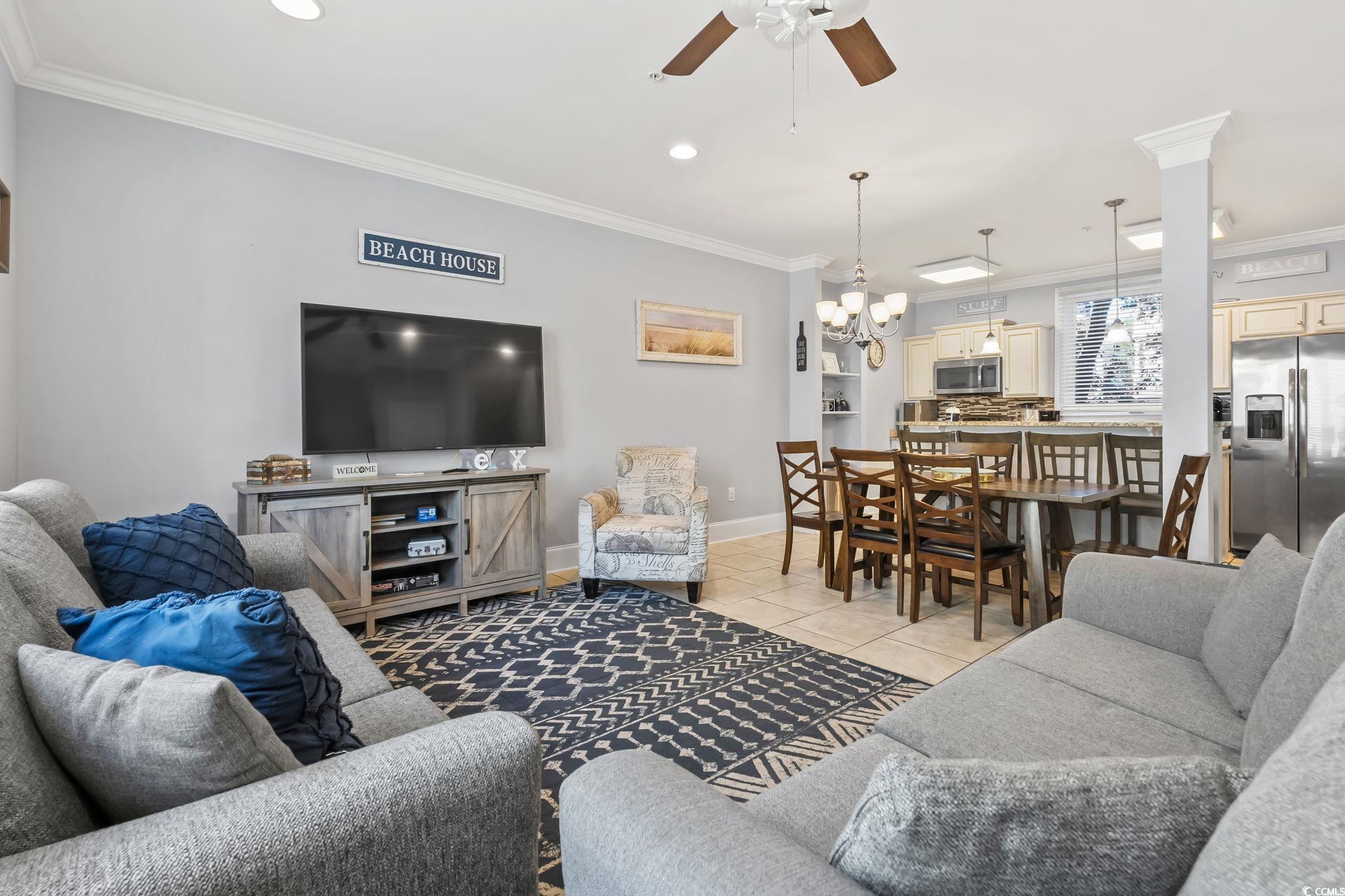 7401 North Ocean Boulevard, Unit 5 Myrtle Beach, SC 29572 - Photo 3 of 34 Living area with ceiling fan, ornamental molding, light tile patterned flooring, recessed lighting, and a chandelier