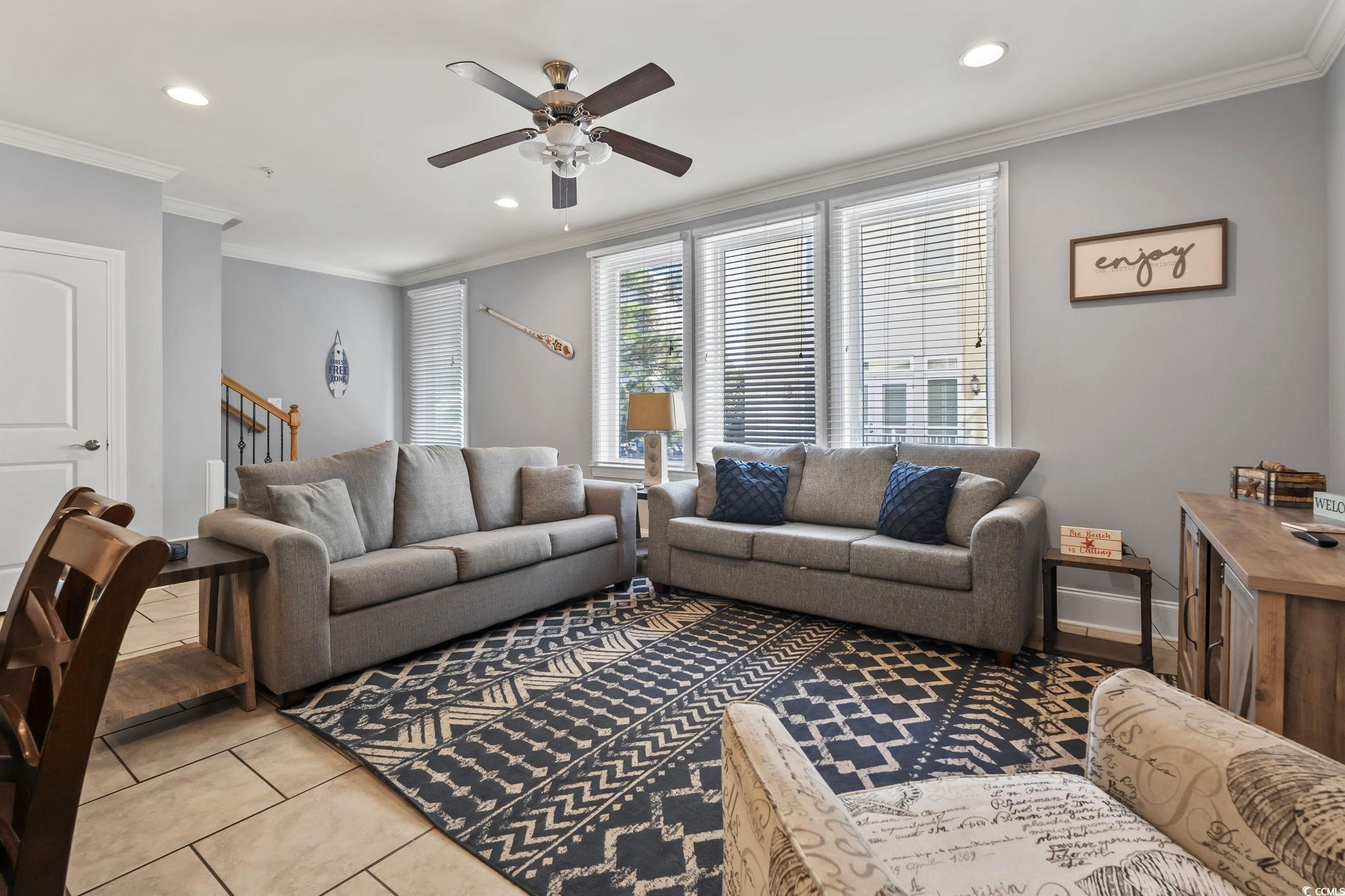 7401 North Ocean Boulevard, Unit 5 Myrtle Beach, SC 29572 - Photo 10 of 34 Tiled living room with ornamental molding, a ceiling fan, stairs, and recessed lighting