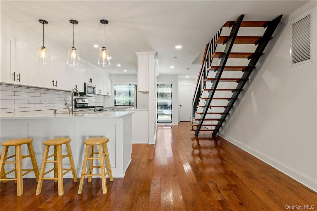 50 Pondview Road, Unit F Rye, NY 10580 - Photo 11 of 25 a view of dining room with furniture and wooden floor