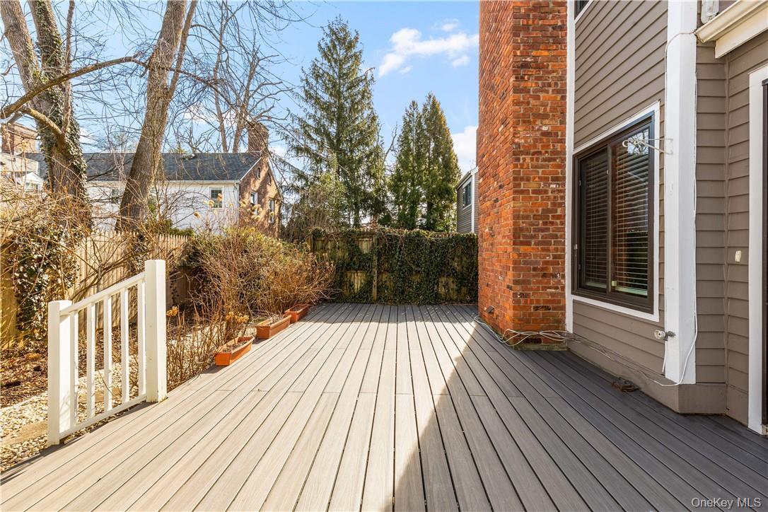 50 Pondview Road, Unit F Rye, NY 10580 - Photo 21 of 25 a view of balcony with wooden floor and fence