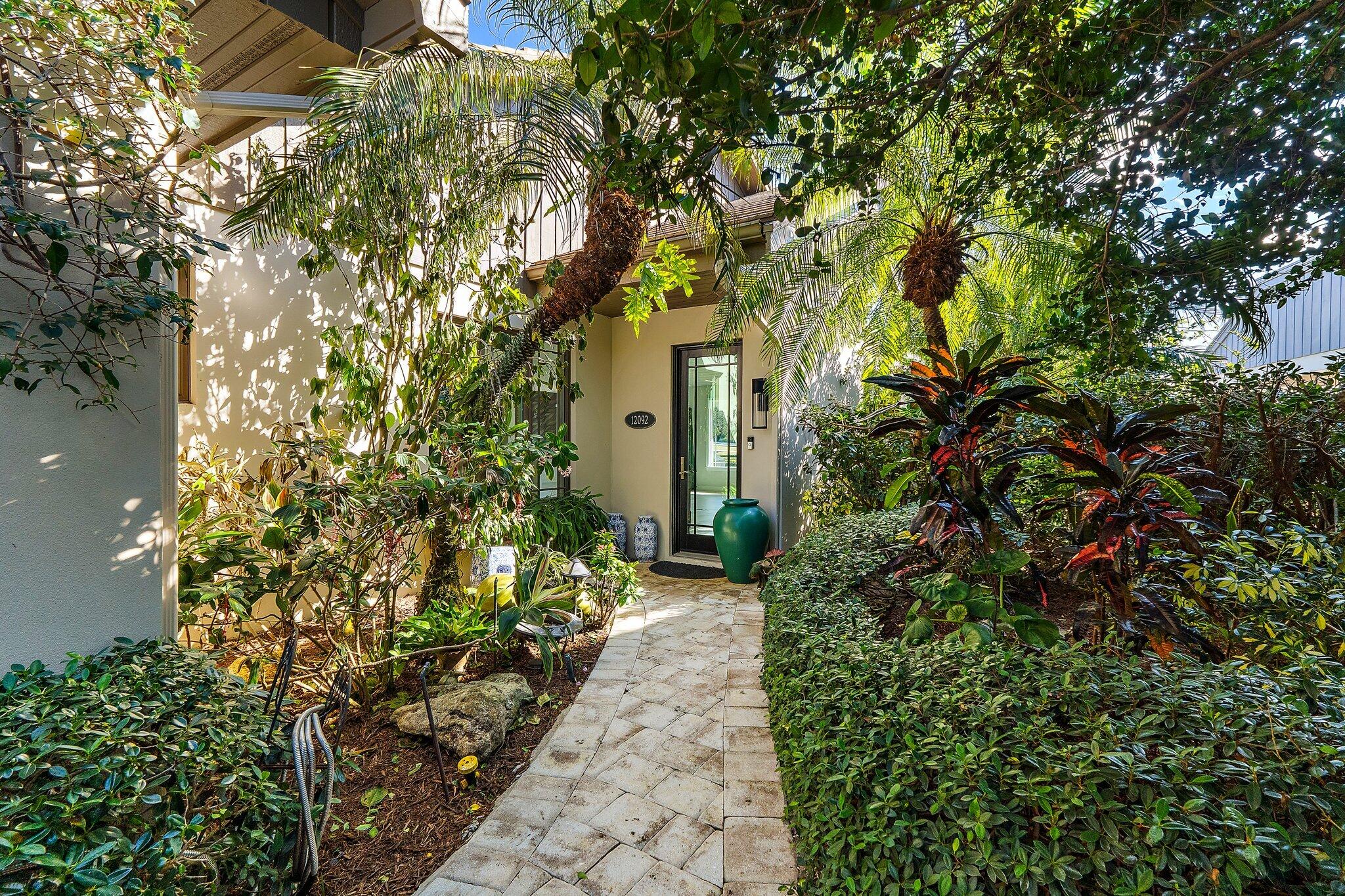 12092 Southeast Birkdale Run Jupiter, FL 33469 - Photo 6 of 52 Sidewalk to Front Entry