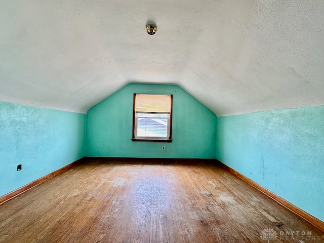 4733 Curtis Drive Springfield, OH 45503 - Photo 35 of 50 This cozy space features sloped ceilings, a single window, and warm wooden flooring.