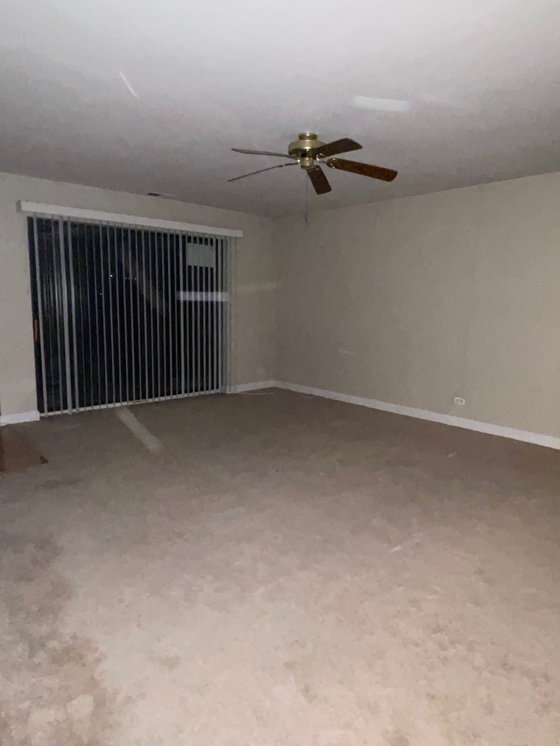 430 Walnut Creek Road, Unit 2306 Lisle, IL 60532 - Photo 8 of 14 a view of a room with a air conditioner