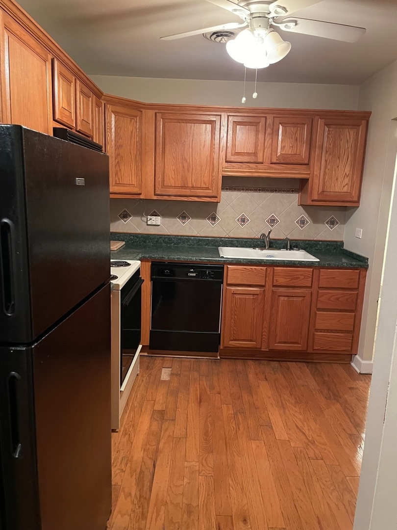 430 Walnut Creek Road, Unit 2306 Lisle, IL 60532 - Photo 9 of 14 a kitchen with stainless steel appliances granite countertop a stove a sink dishwasher and a refrigerator