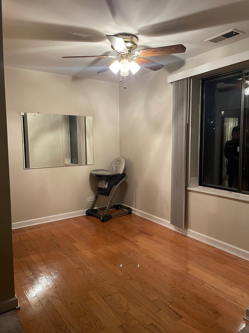 430 Walnut Creek Road, Unit 2306 Lisle, IL 60532 - Photo 10 of 14 a room with furniture and a window