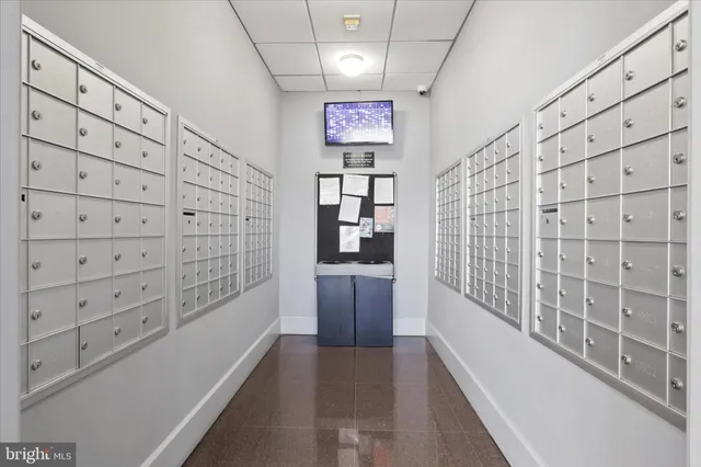 a living room with fireplace furniture and a large window