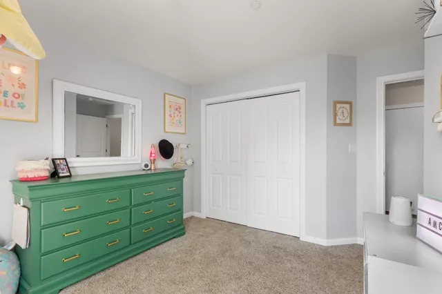 a room with a dresser and a mirror