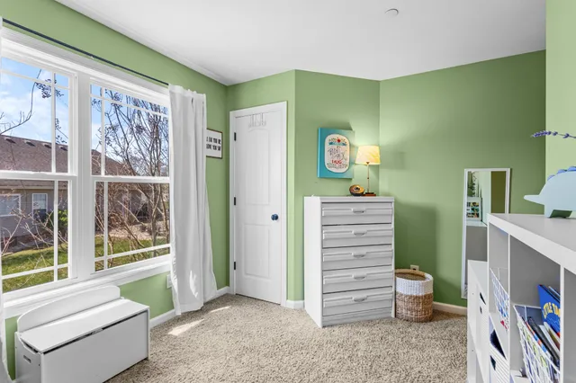a view of room with window and bathroom