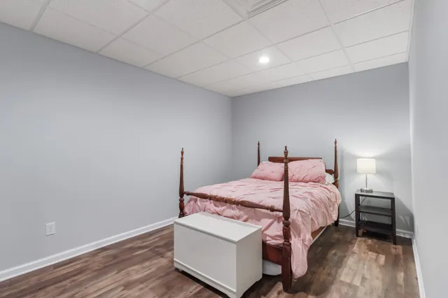 a bedroom with a bed and a lamp