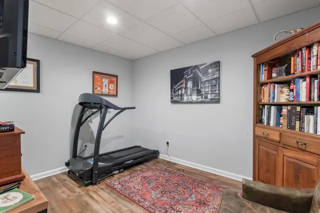 a view of room with lounge chair and book shelf