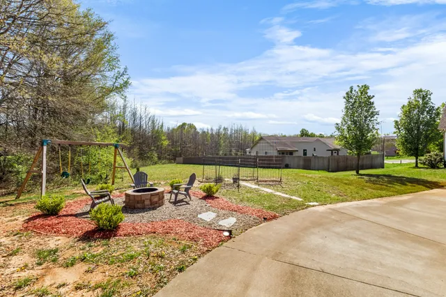 a view of a park with swings and slides