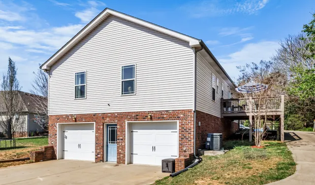 a view of a white house with a large windows