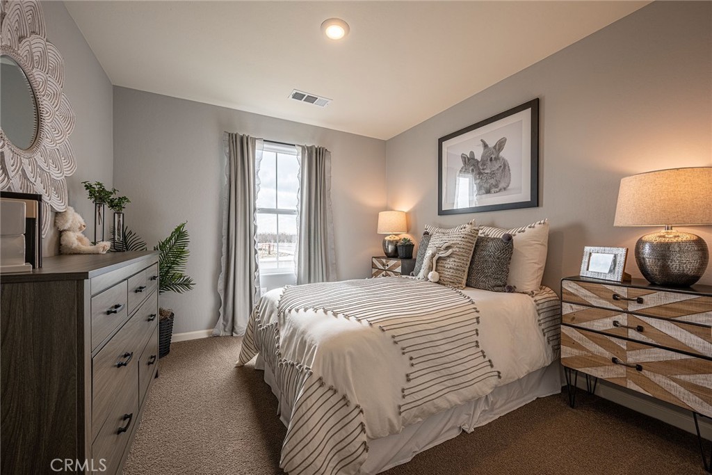 74 Blueberry Lane, Unit 31 SH Merced, CA 95341 - Photo 15 of 19 a bedroom with a bed and a window
