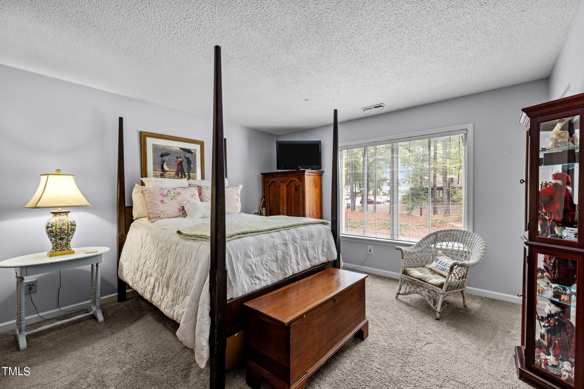 1917 Front Street, Unit 4C Durham, NC 27705 - Photo 31 of 53 a bedroom with a bed and a window