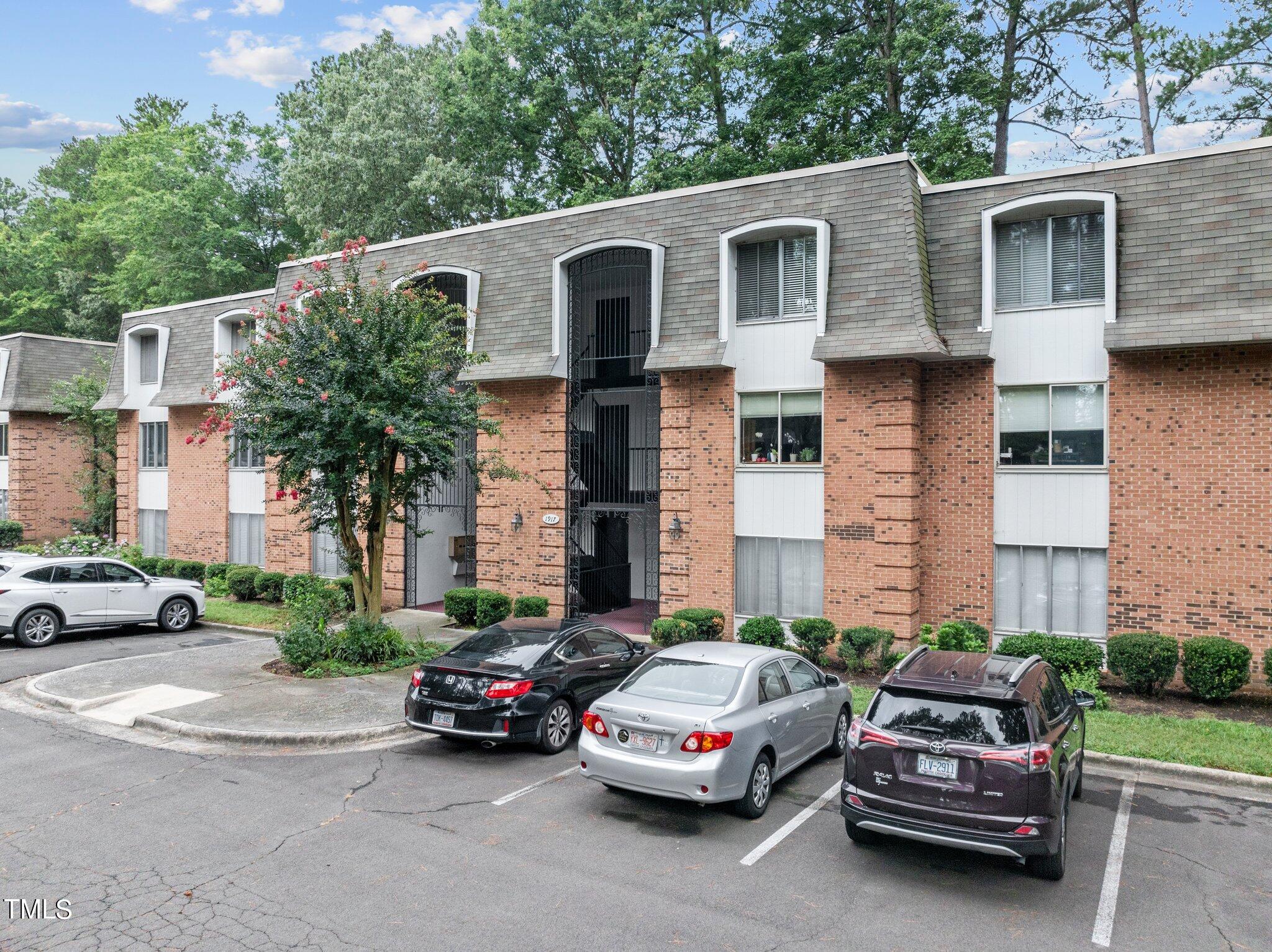 1917 Front Street, Unit 4C Durham, NC 27705 - Photo 4 of 53 a car parked in front of a house