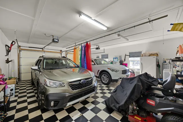 a utility room with dryer washer and other items