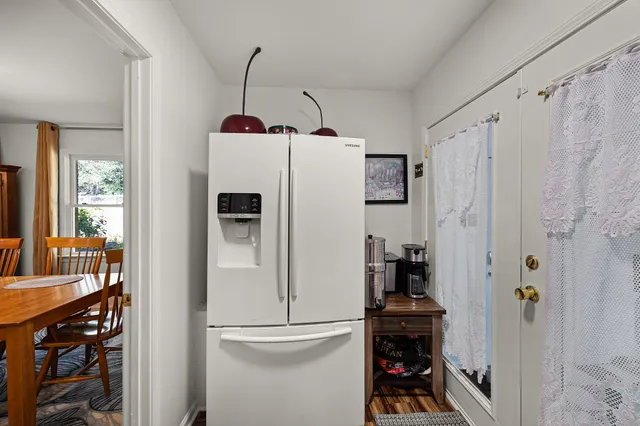 a white refrigerator freezer sitting inside of a kitchen