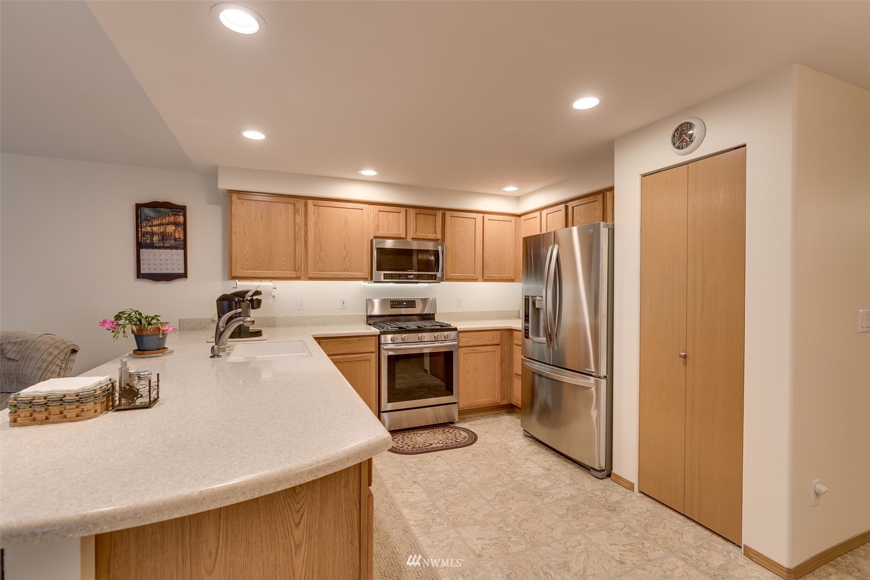 8322 Skinner Road Granite Falls, WA 98252 - Photo 11 of 40 a kitchen with stainless steel appliances granite countertop a refrigerator sink and stove