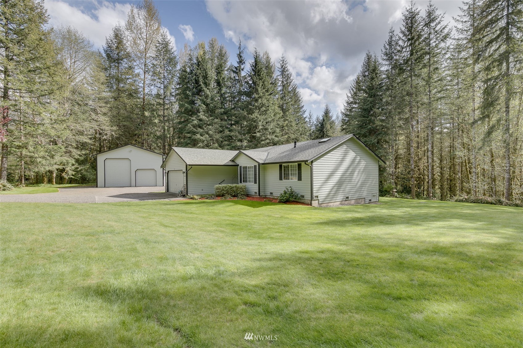 8322 Skinner Road Granite Falls, WA 98252 - Photo 26 of 40 a front view of house with yard and trees