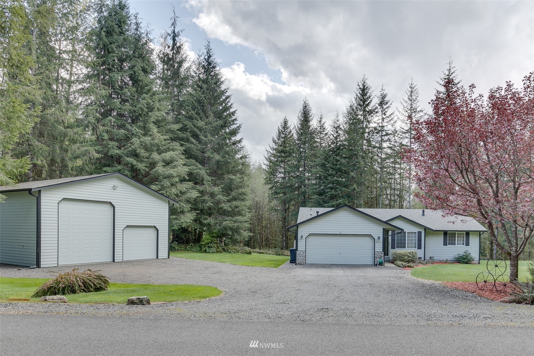 8322 Skinner Road Granite Falls, WA 98252 - Photo 3 of 40 a house with trees in front of it