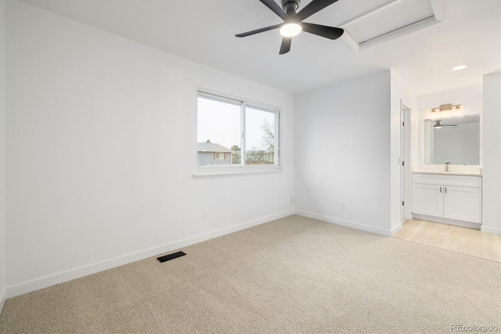 8612 Carr Loop Arvada, CO 80005 - Photo 12 of 35 an empty room with a empty space and windows