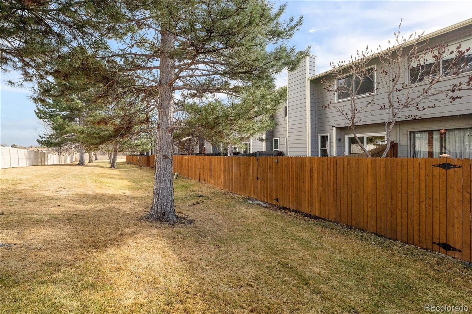 8612 Carr Loop Arvada, CO 80005 - Photo 24 of 35 a view of a yard with wooden fence
