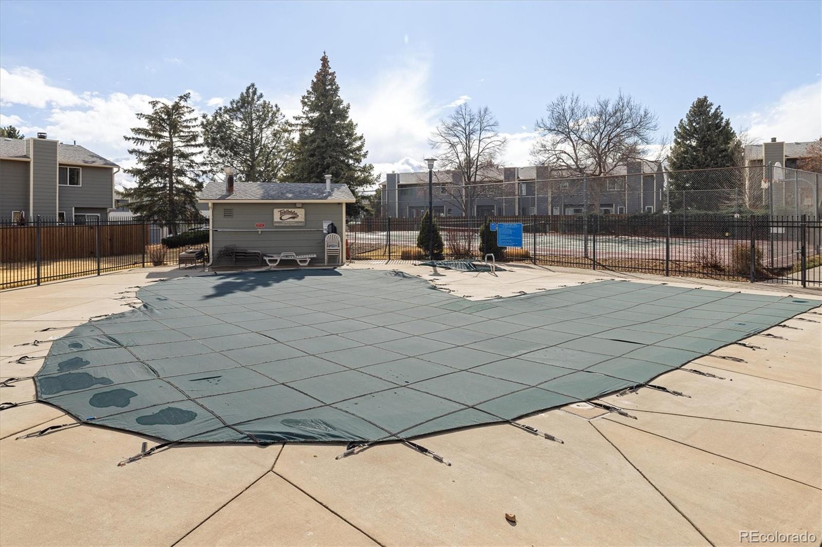 8612 Carr Loop Arvada, CO 80005 - Photo 31 of 35 a white house with trees in front of it