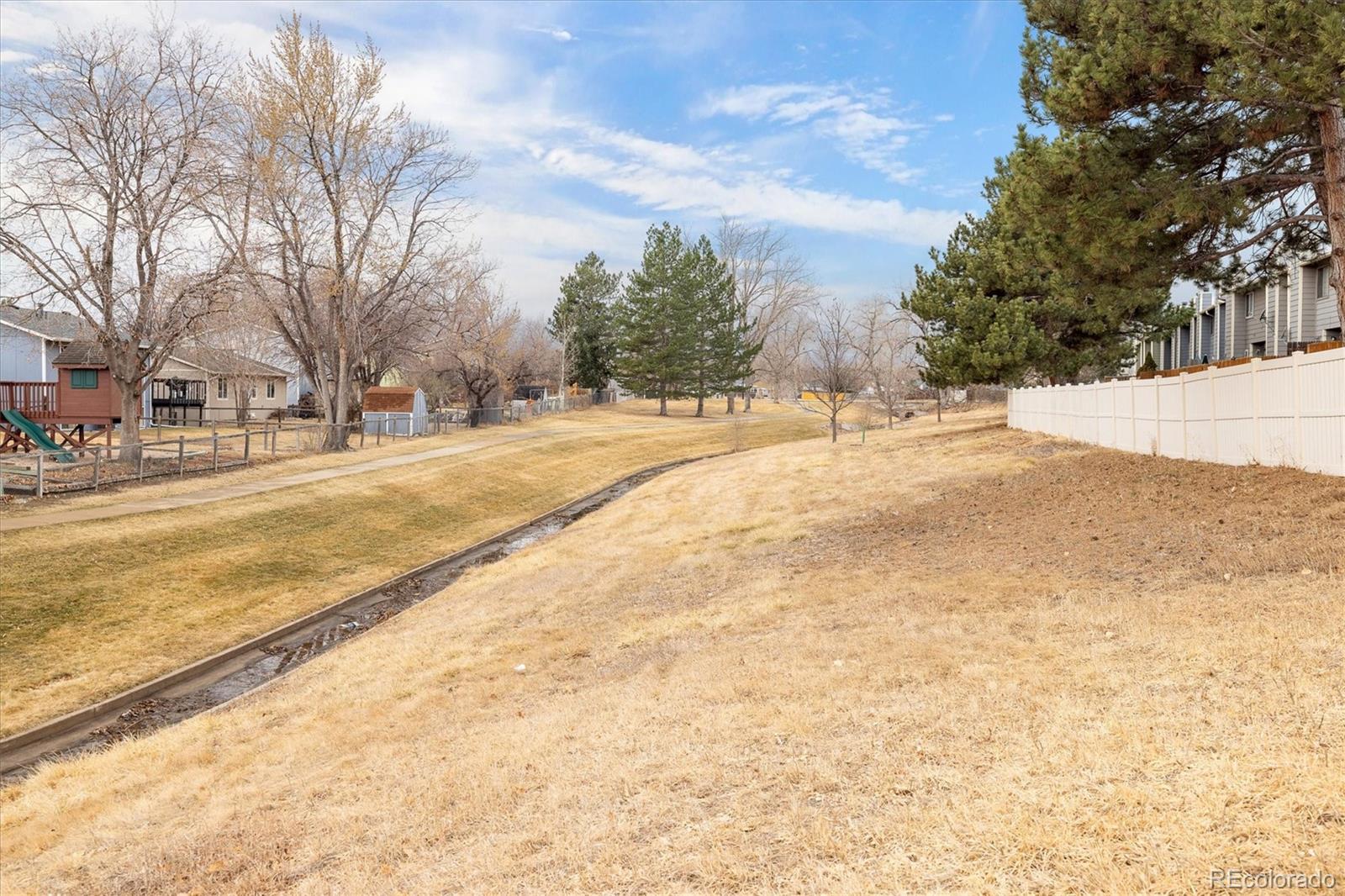 8612 Carr Loop Arvada, CO 80005 - Photo 33 of 35 a view of road with large trees
