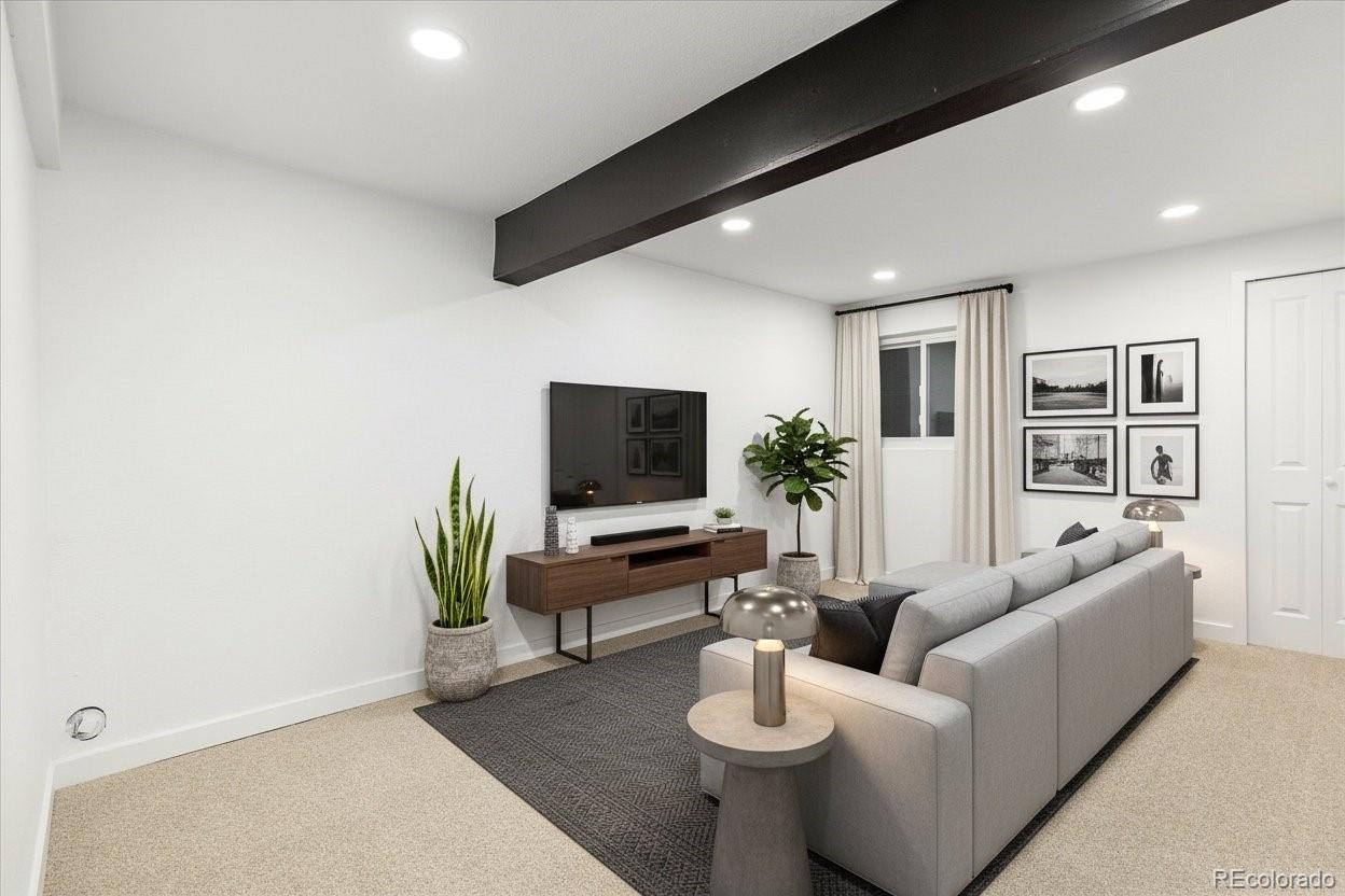 8612 Carr Loop Arvada, CO 80005 - Photo 4 of 35 a living room with furniture and a flat screen tv