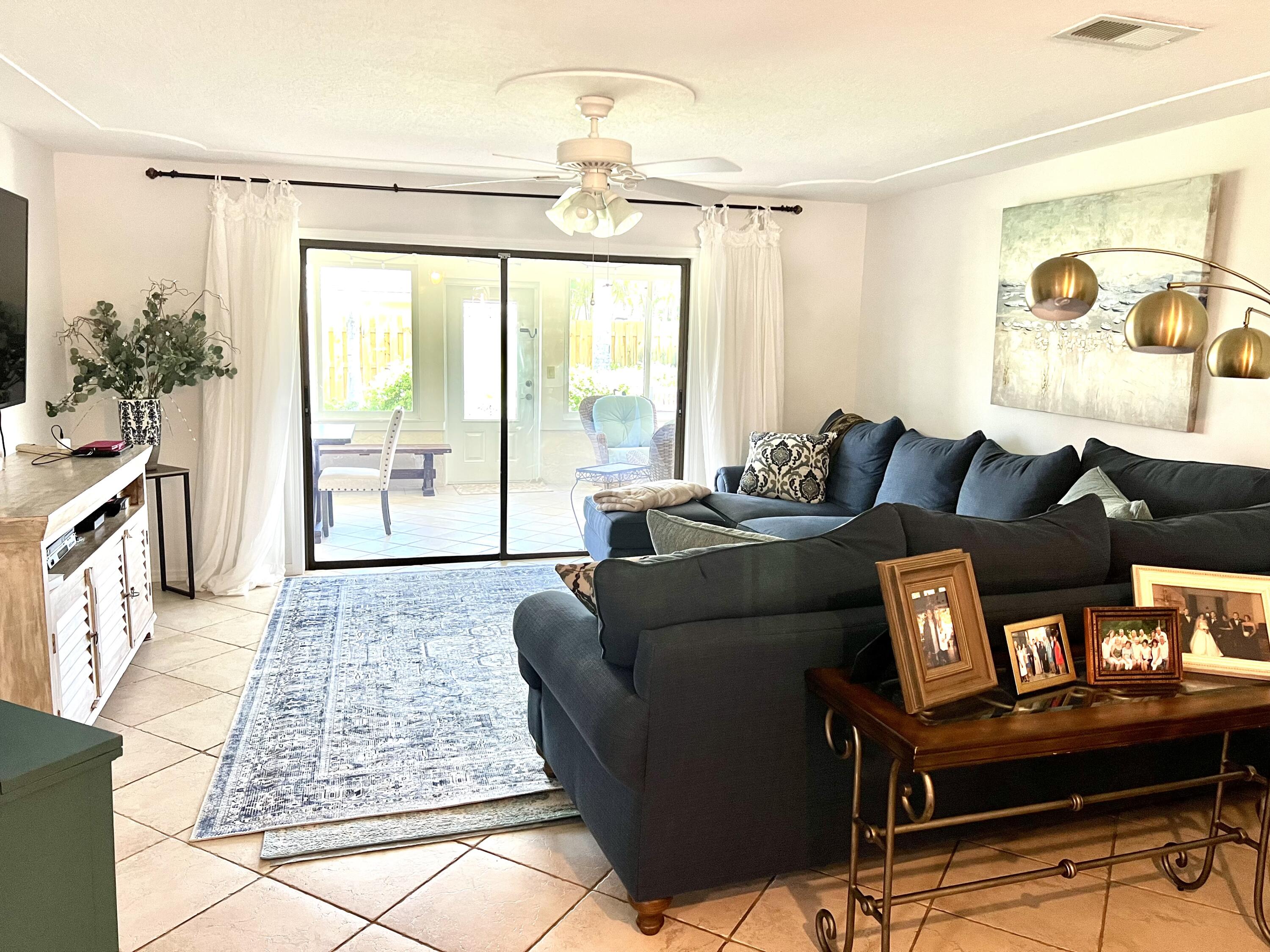 410 Rio Casa Drive South Indialantic, FL 32903 - Photo 4 of 25 a living room with furniture and a large window