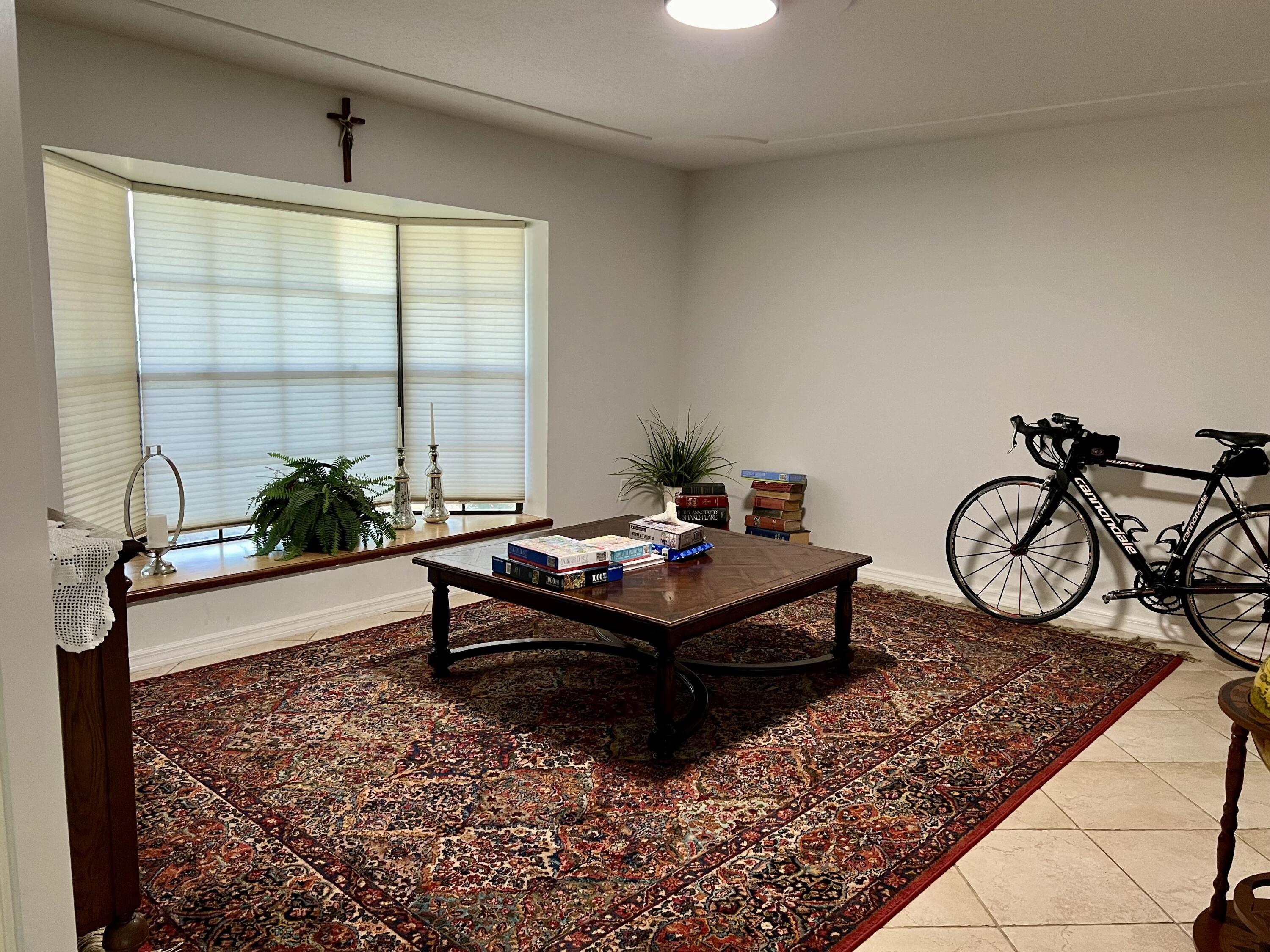 410 Rio Casa Drive South Indialantic, FL 32903 - Photo 5 of 25 a living room with furniture a window and a table