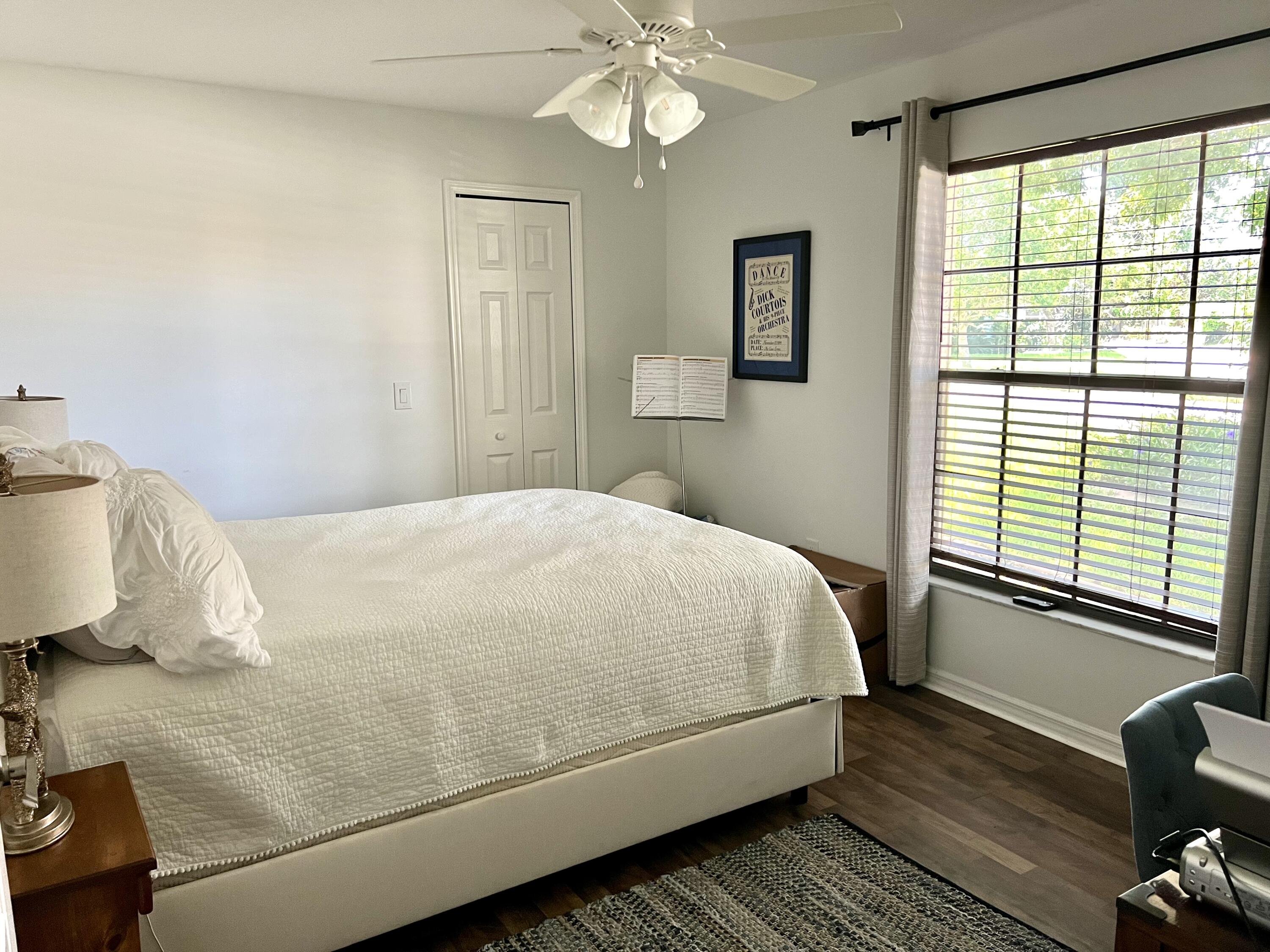 410 Rio Casa Drive South Indialantic, FL 32903 - Photo 6 of 25 a bedroom with a bed and wooden floor