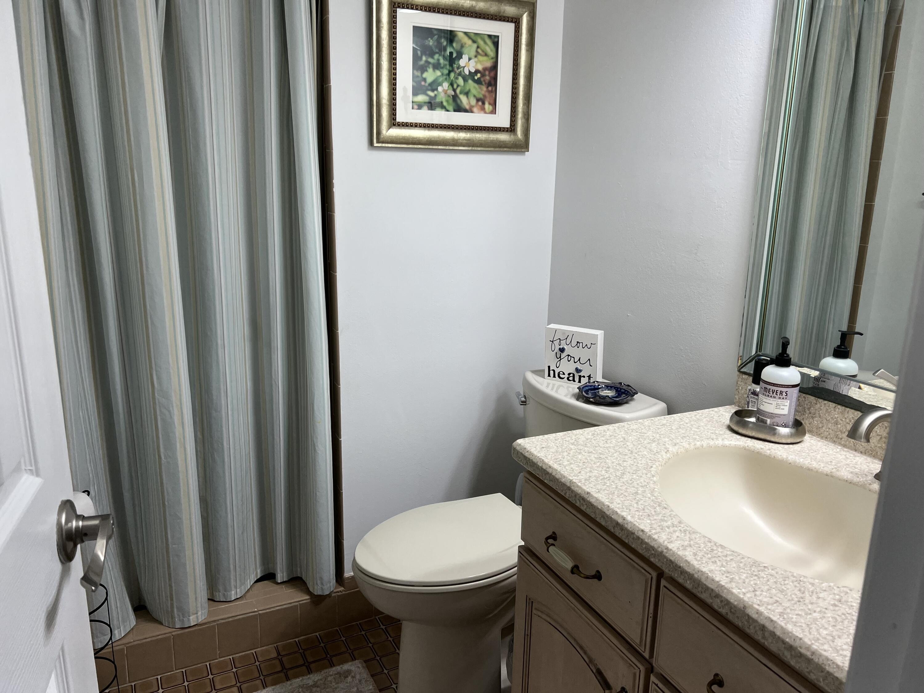 410 Rio Casa Drive South Indialantic, FL 32903 - Photo 7 of 25 a bathroom with a sink and a toilet