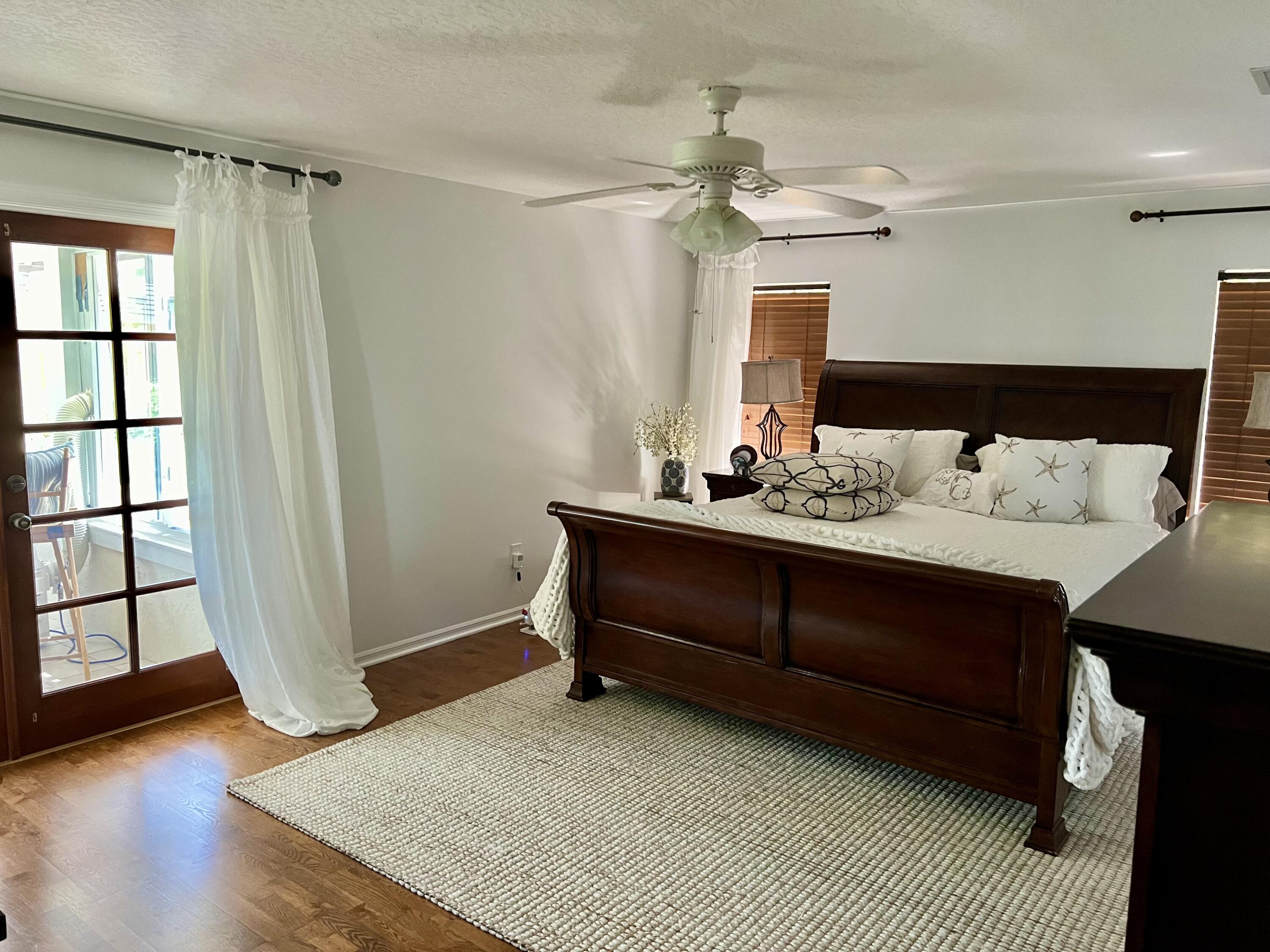 410 Rio Casa Drive South Indialantic, FL 32903 - Photo 8 of 25 a bedroom with a bed and a window