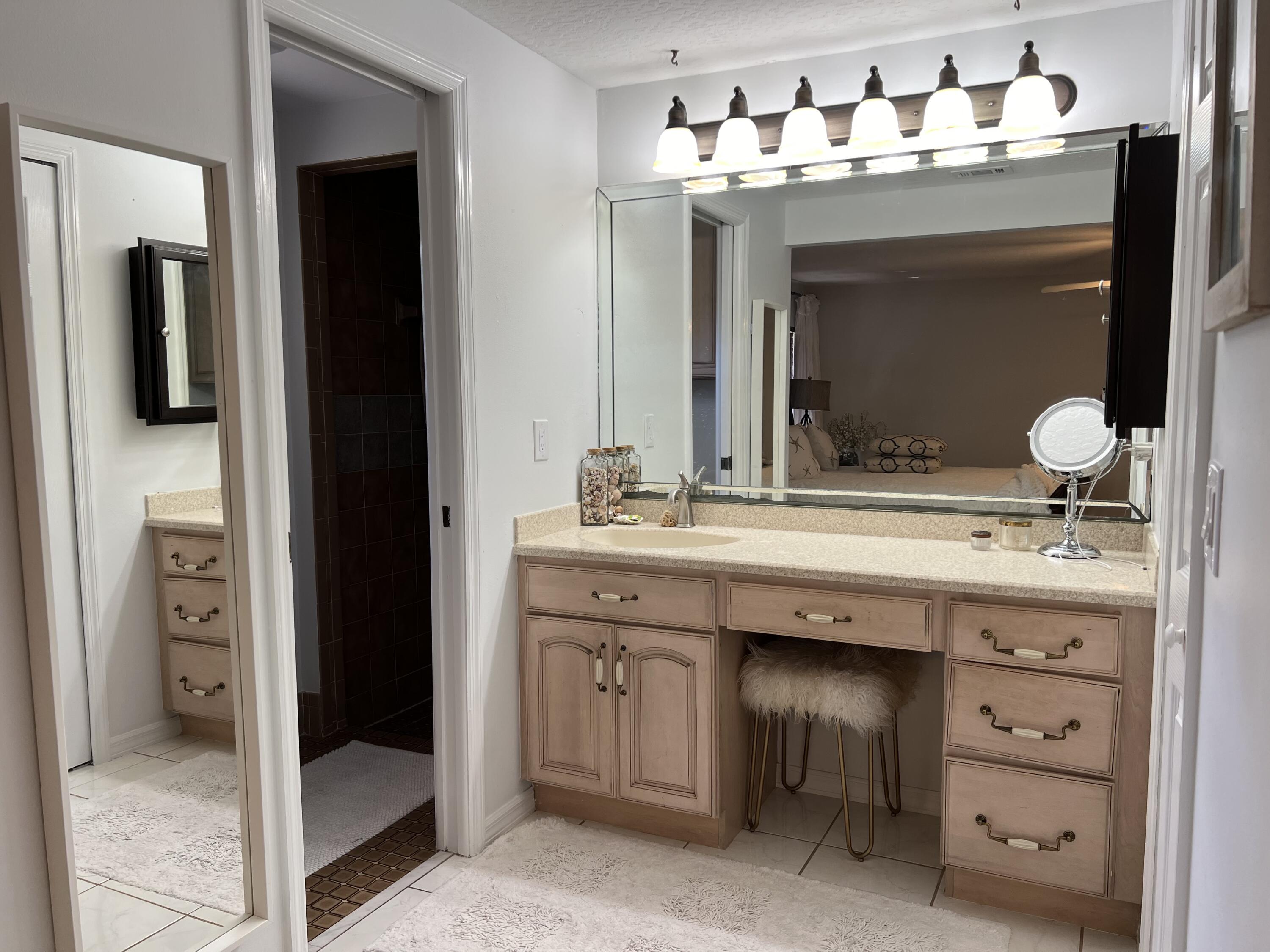 410 Rio Casa Drive South Indialantic, FL 32903 - Photo 9 of 25 a bathroom with a sink double vanity and a mirror