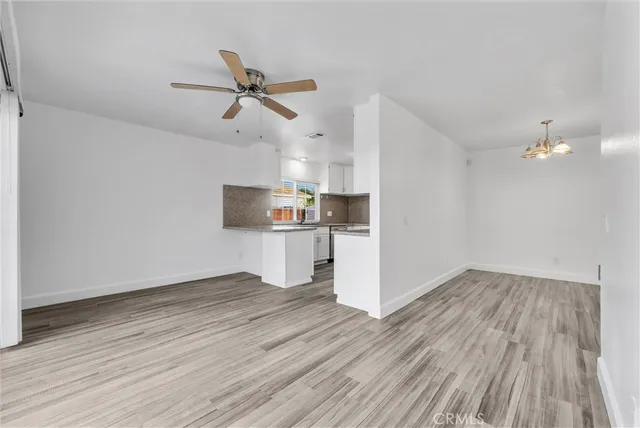 a view of kitchen and wooden floor