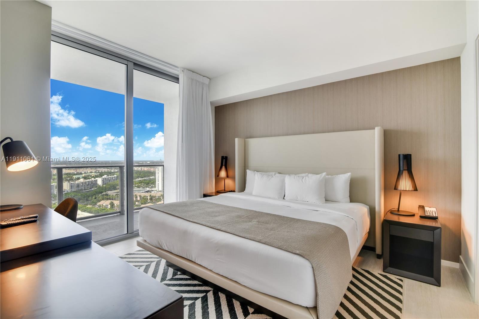 4010 South Ocean Drive, Unit R3206 Hollywood, FL 33019 - Photo 12 of 37 a bedroom with a bed and a night stand