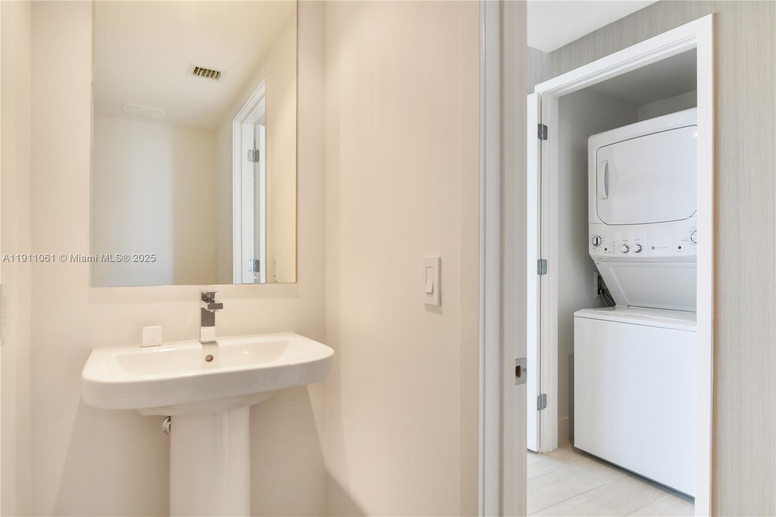 4010 South Ocean Drive, Unit R3206 Hollywood, FL 33019 - Photo 15 of 37 a bathroom with a sink and a mirror