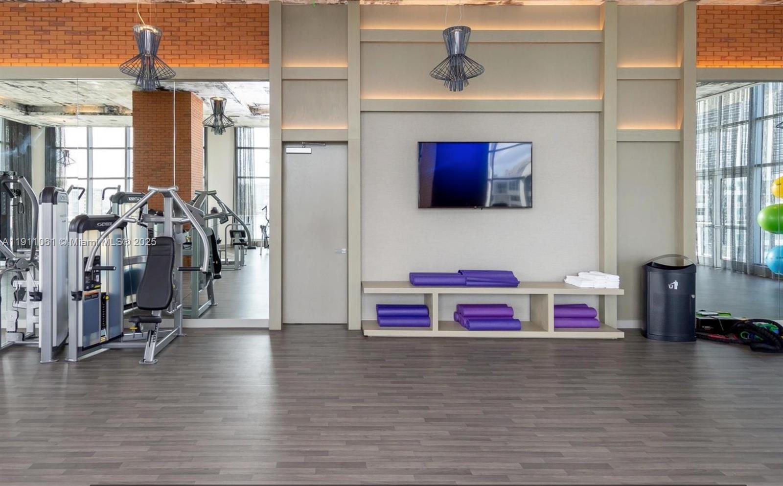 4010 South Ocean Drive, Unit R3206 Hollywood, FL 33019 - Photo 24 of 37 a living room with furniture and a flat screen tv