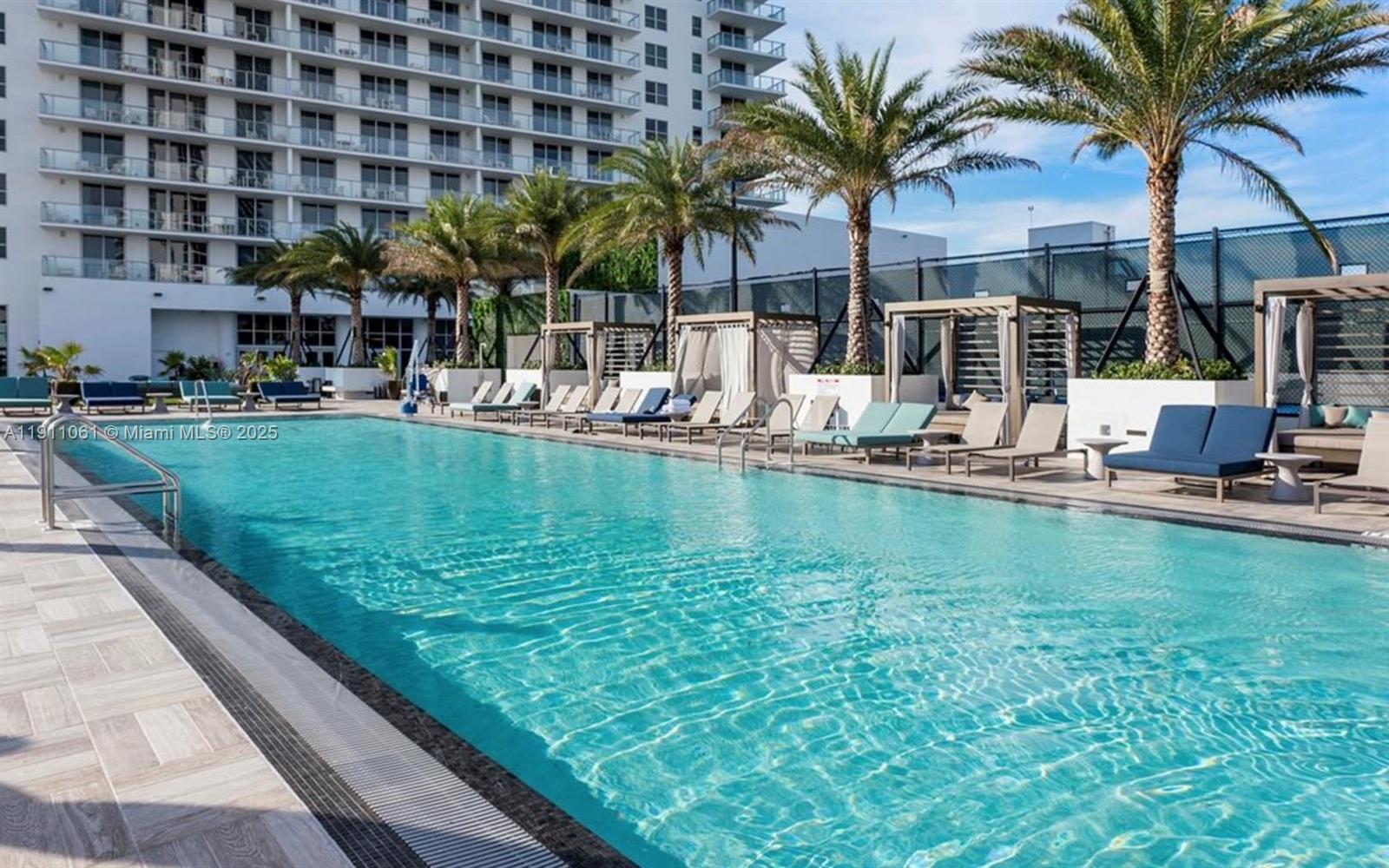 4010 South Ocean Drive, Unit R3206 Hollywood, FL 33019 - Photo 28 of 37 a view of swimming pool with palm trees